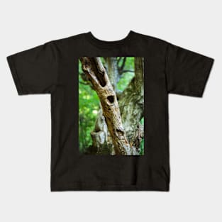 Dead tree in a young forest Kids T-Shirt